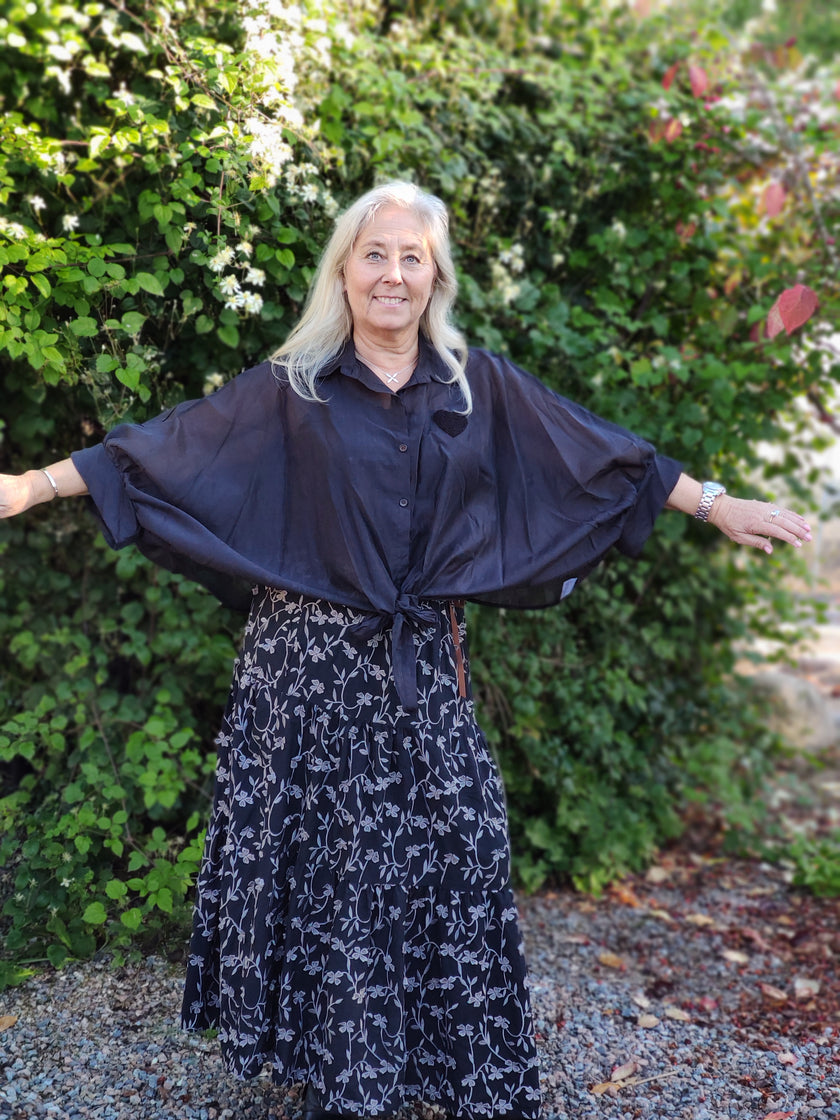 Blus, ponchoblus, Minou