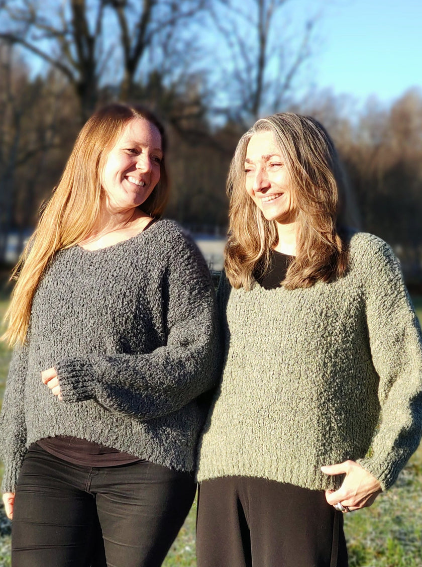 Stickad tröja med muddärm