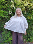 Blus med vidd, Minou